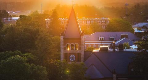 Thompson Hall's spire in misty bright sunlight